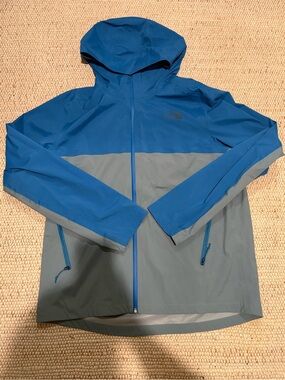 The North Face Blue and Gray Hooded Rain Jacket